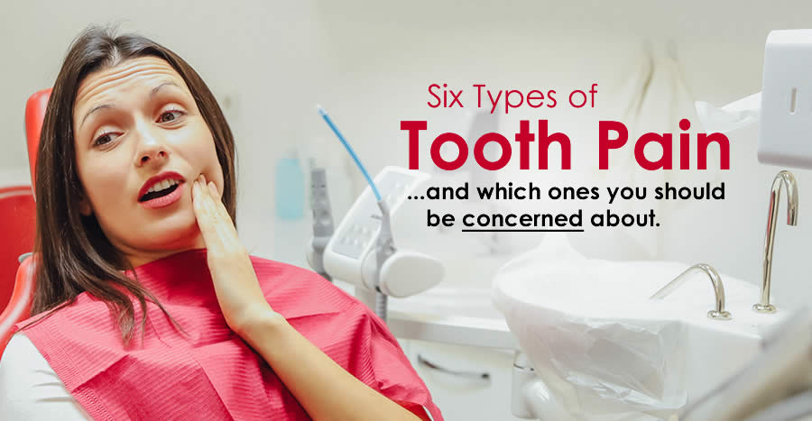 Photograph of a woman with short brown hair holding the left side of her mouth in pain while at the dentist.