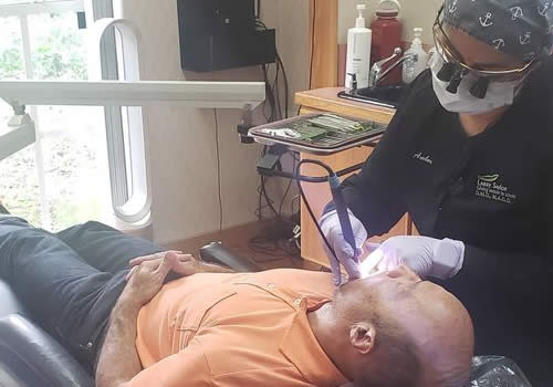 Man getting his teeth cleaned for proactive maintenance