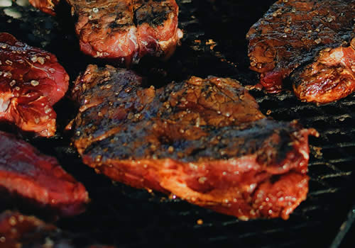 Meat cooking on the grill