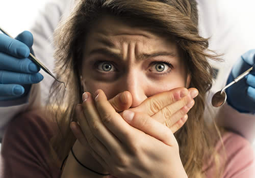 Woman in dentist chair with fear of dentist