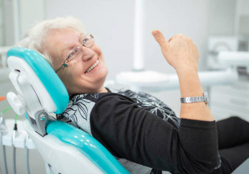 Senior after receiving safe dental cleaning during COVID-19
